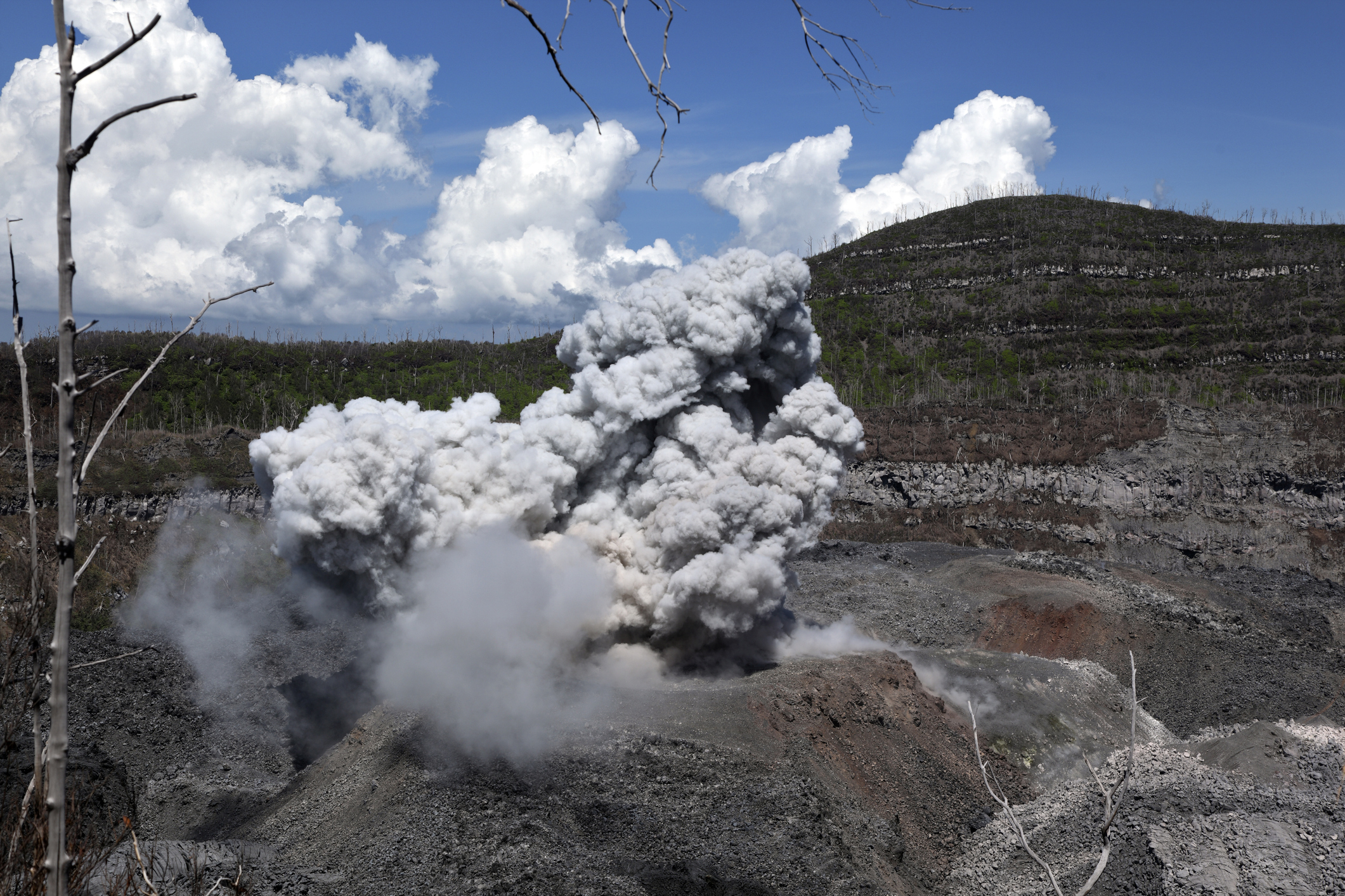 Indonesia’s Ibu volcano erupts twice, spewing red-hot lava