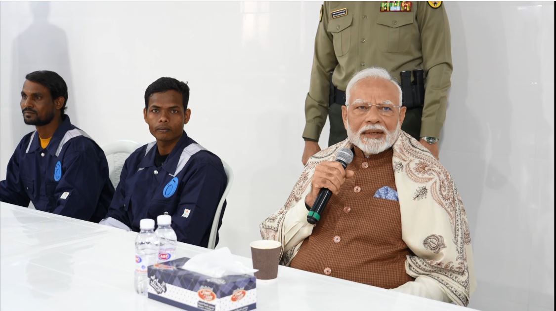 PM Modi interacts with Indian workers at Gulf Spic Labour Camp in Kuwait