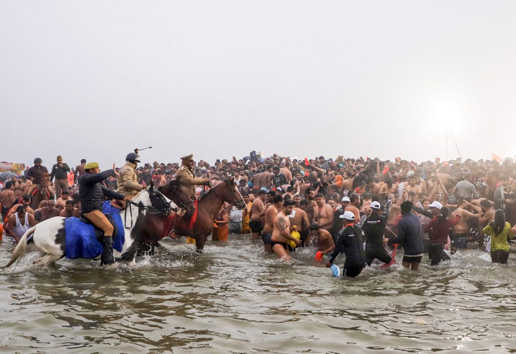 Mounted police patrol at Triveni Sangam during Maha Kumbh 2025