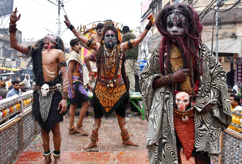 Artists perform during the entry procession of Shri Panchayati Akhara Bada Udasin