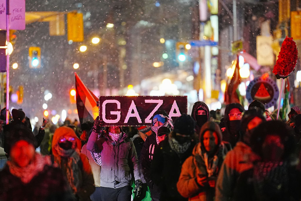 Pro-Palestinian demonstrators carrying a banner reading 'Gaza' march during a protest against Israeli attacks in Gaza since the announcement of the ceasefire, on January 16, 2025 in Toronto, Ontario. Photo by Mert Alper Dervis/Anadolu via Getty Images