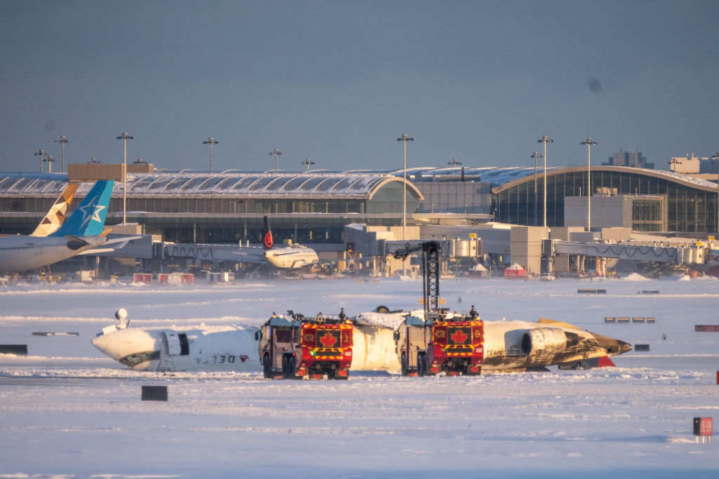 Delta plane flips upside down on landing at Toronto airport, injuring 18