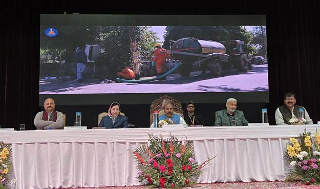 Union Minister Virendra Kumar distributes PPE kits and health cards to sanitation workers in Jammu