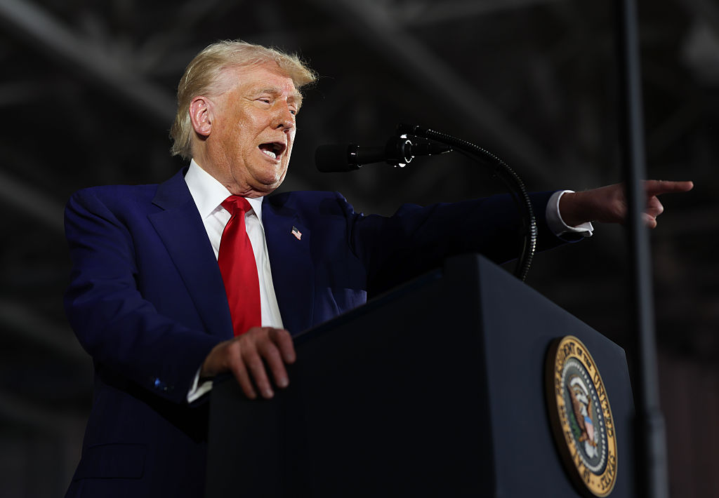 Trump touts economy at Michigan 100-day rally, as Americans grow wary