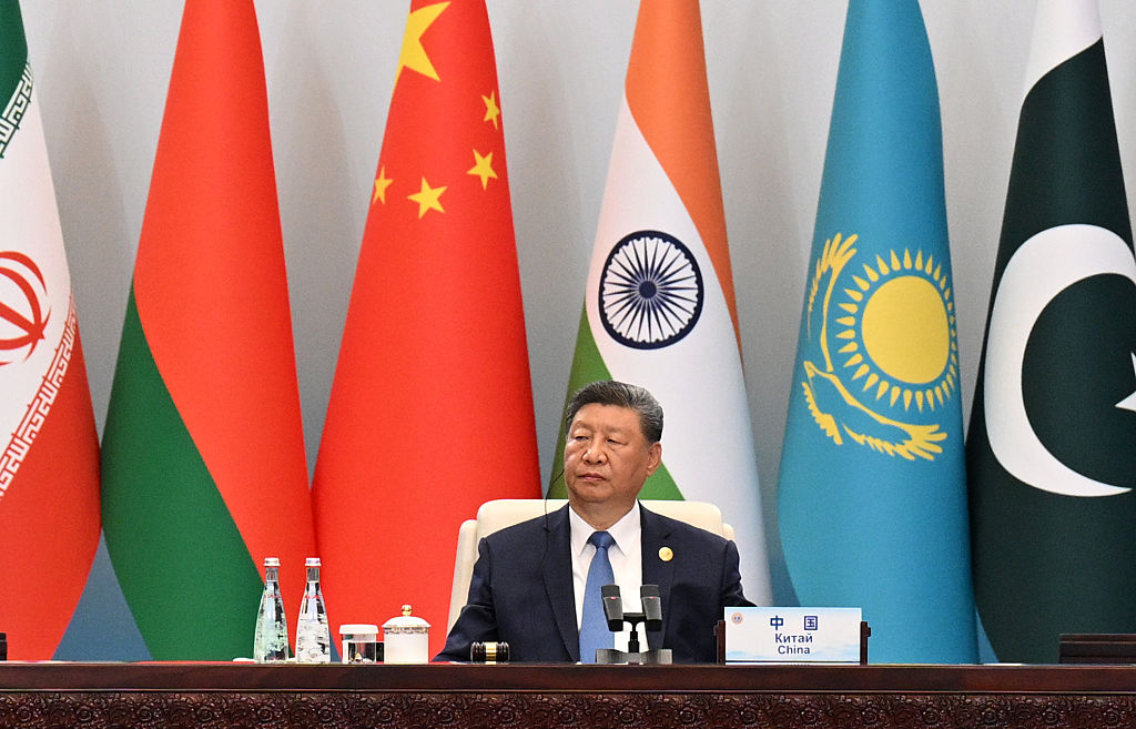 China’s Xi pushes a new global order, flanked by leaders of Russia and India