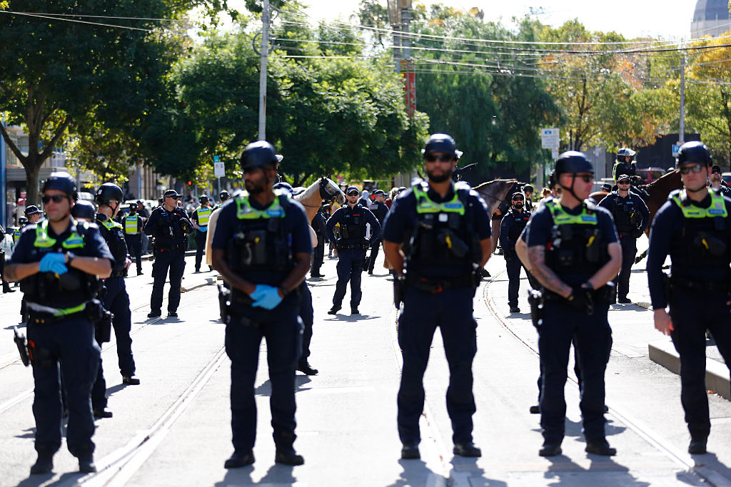 Protesters clash with Australian police after suspected killer of Indigenous girl arrested