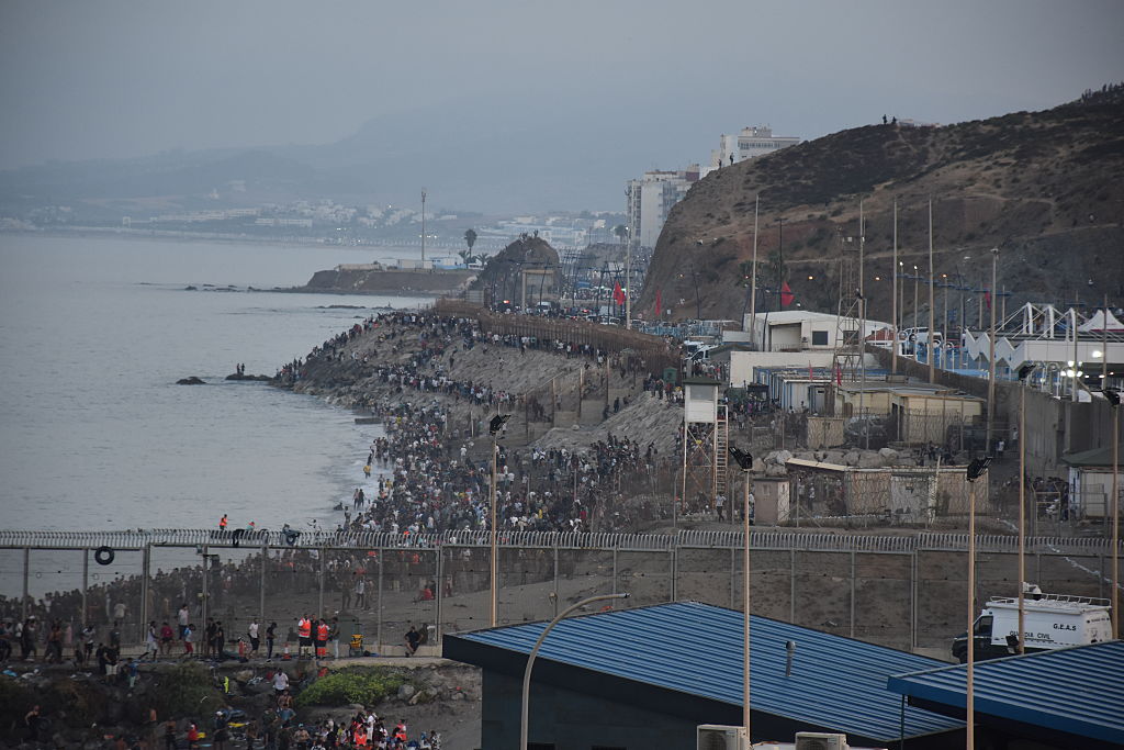 Spain, Morocco try to halt deadly rush on Spanish enclave after tens of thousands cross in a day
