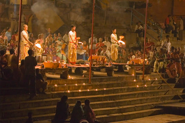 Locals gather for candle and lamp lighting by the Ganges to celebrate Diwali.