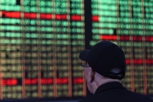 Shares seesaw in Asia as earnings loom, oil skids
