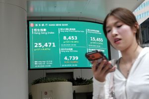 Tech leads shares higher in Asia, oil eases