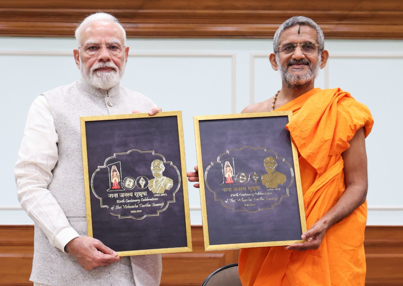 PM Modi unveils logo for birth centenary celebrations of Sri Vishwesha Tirtha Swami